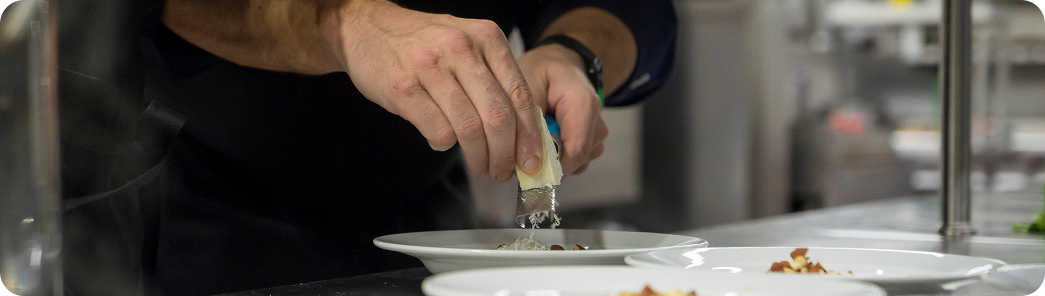 Chef finishing a plate at Kitchen King